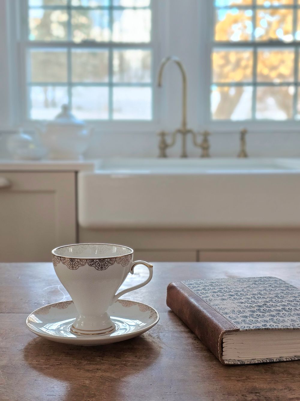 White Porcelain Tea Cup and Saucer with Gold Lace Design
